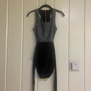 Albion Fit black and white checkered one piece swimsuit.